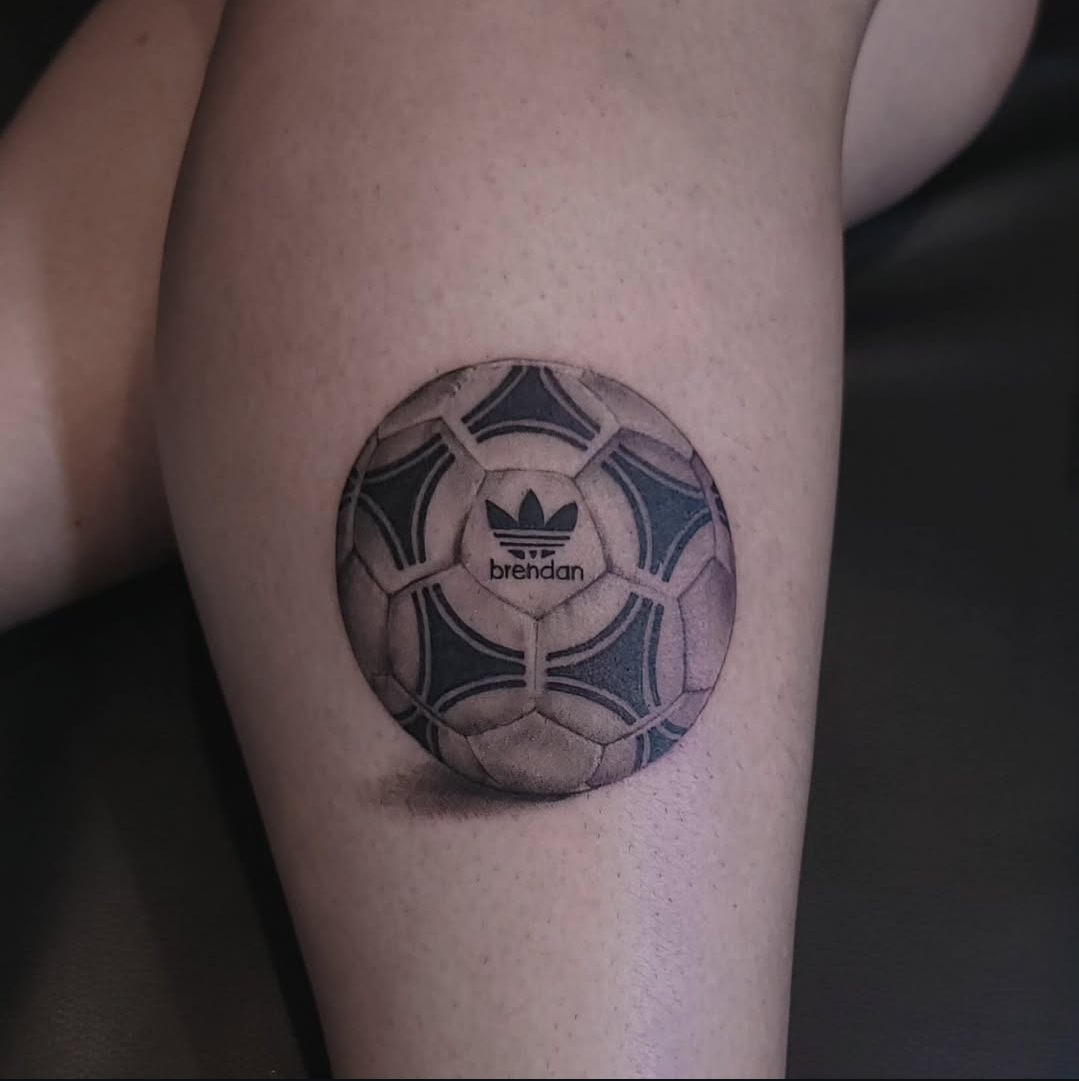Blackwork soccer ball tattoo